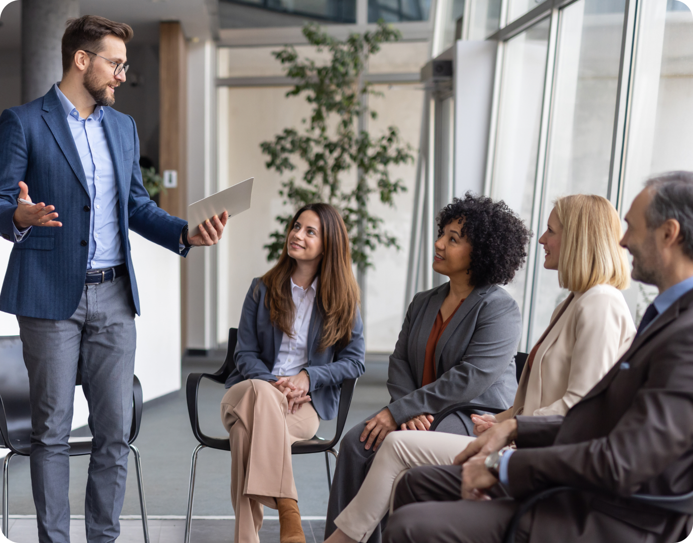 Group of colleagues engaged in conversation.
