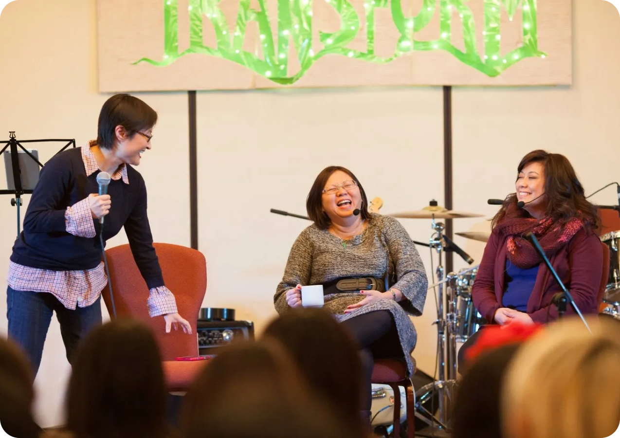 Women enjoying a conversation at an event.