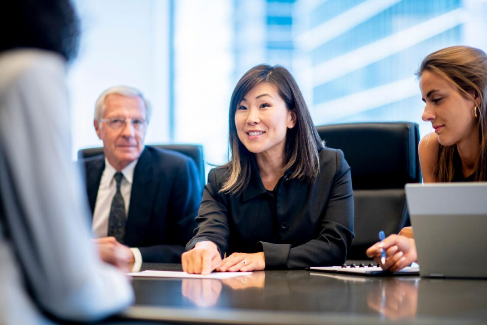 Professional team meeting at conference table